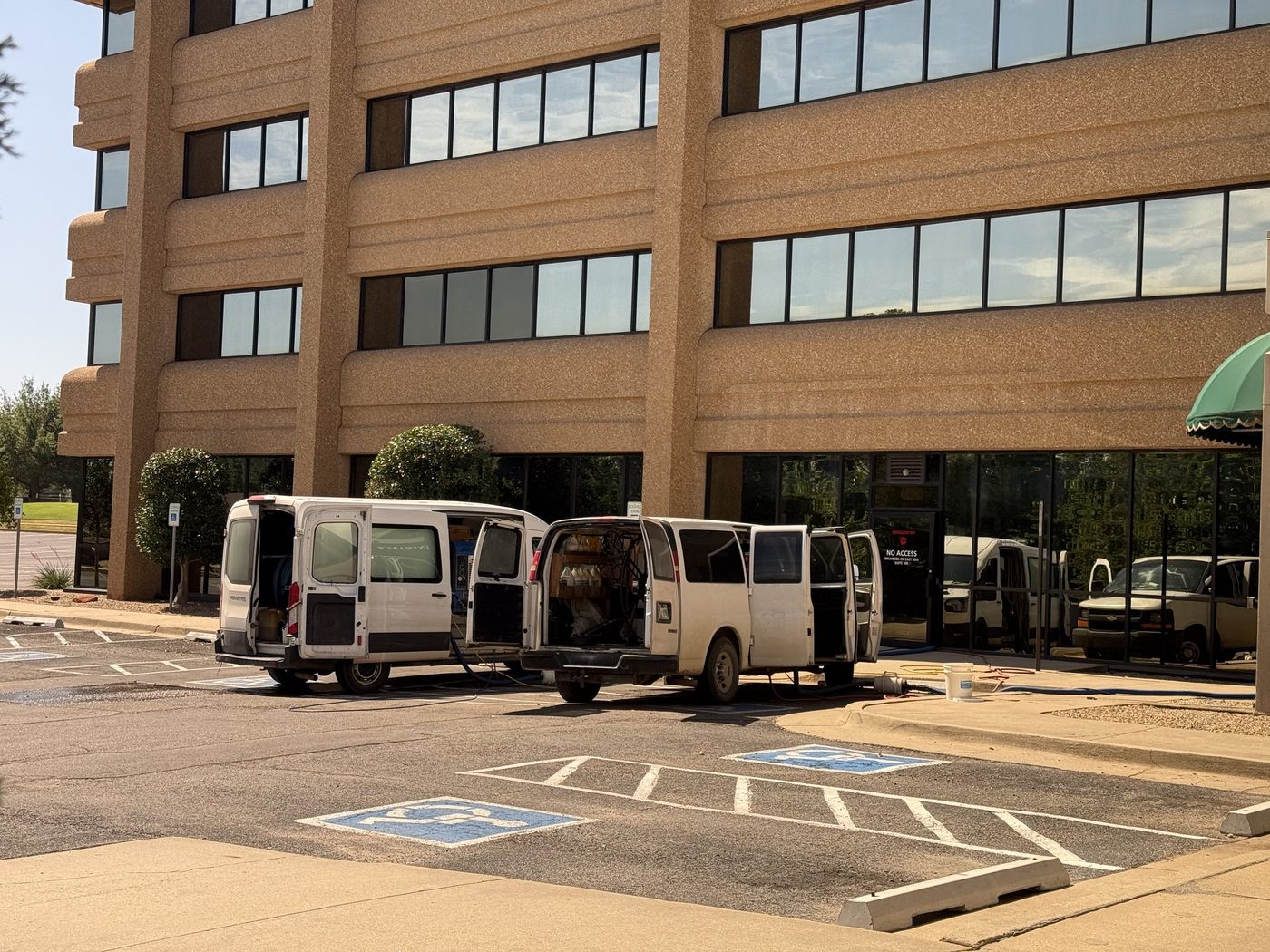 Service vans staged at a commercial job